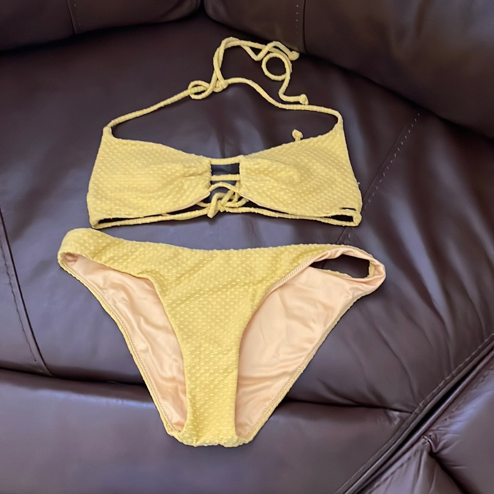 Never used yellow bathing suit